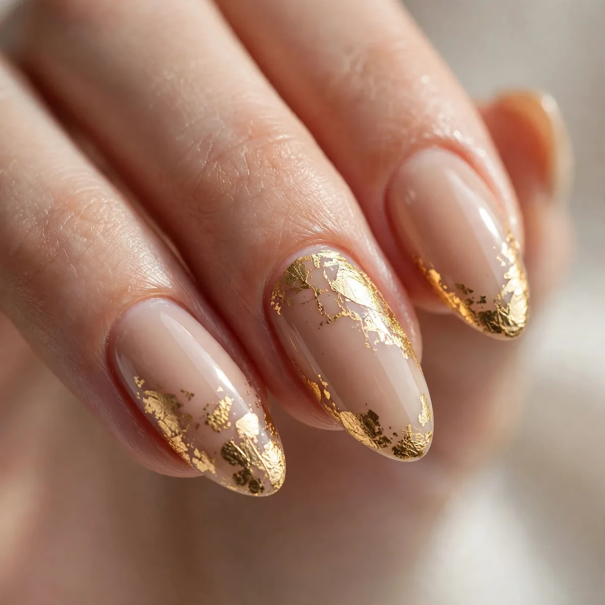 Gold foil accent on almond nails