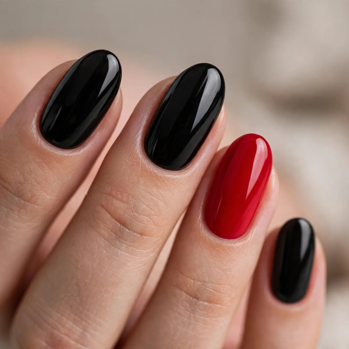 Black nails with one red accent