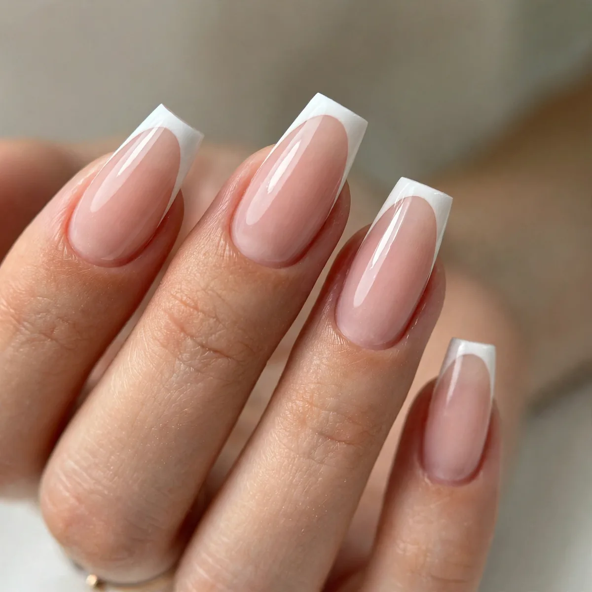 French tips on coffin-shaped nails