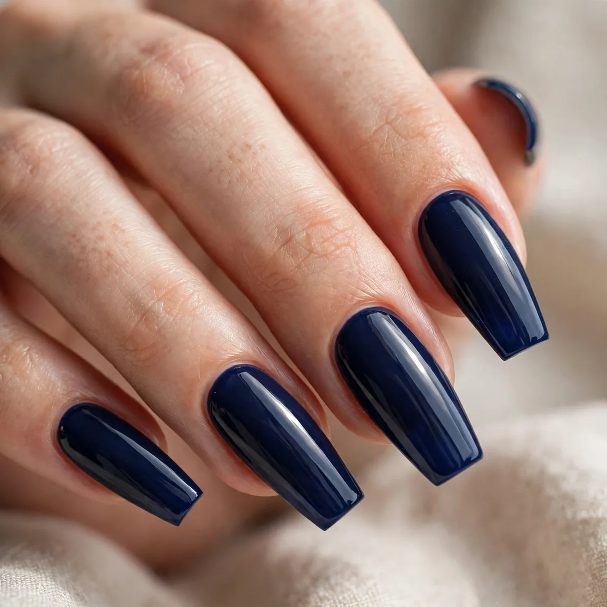 Navy blue coffin-shaped nails