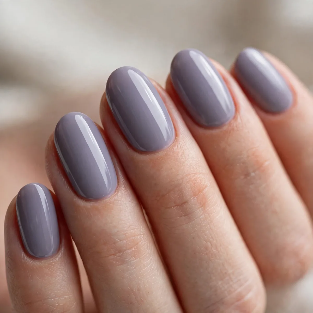 Lavender gray polish on oval nails