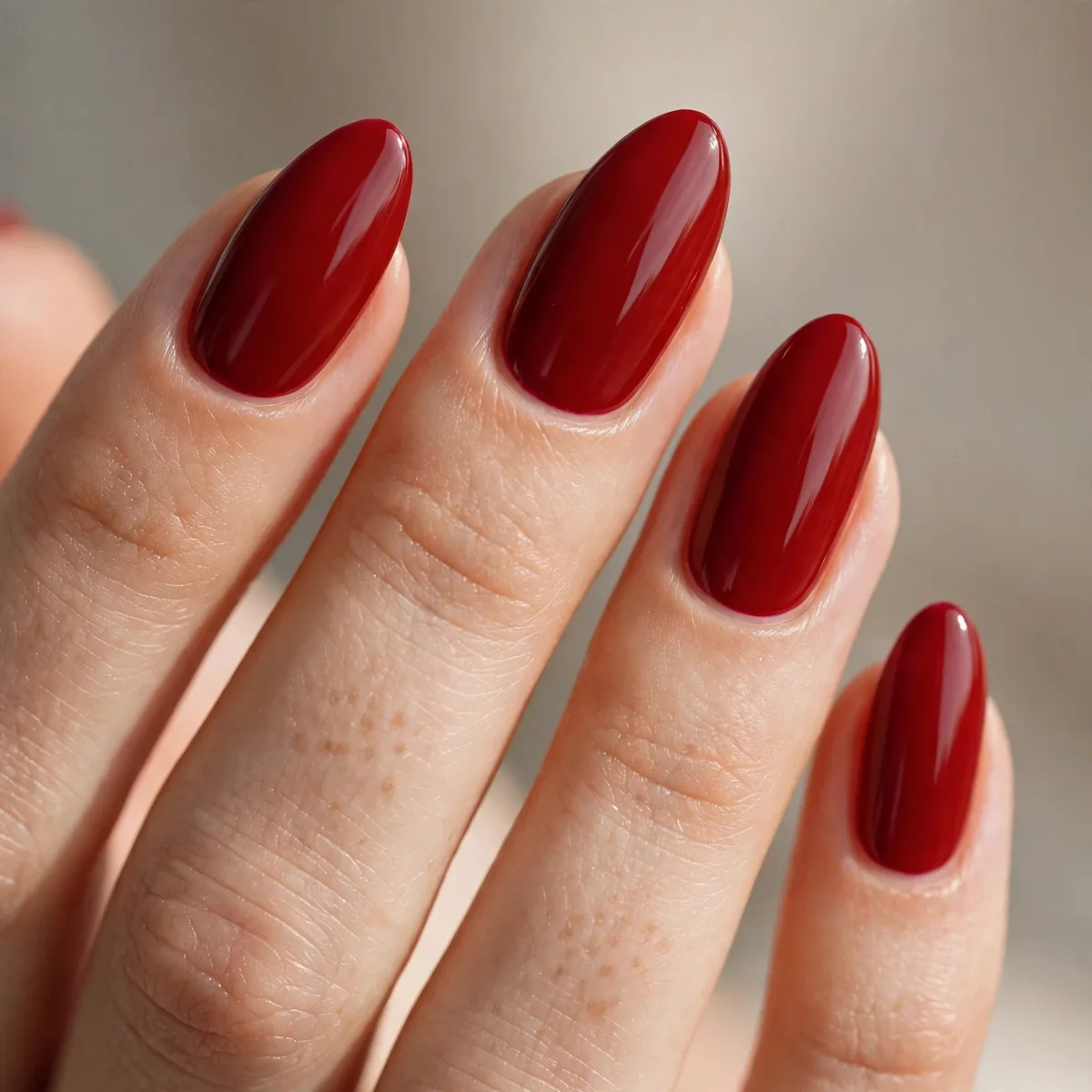 Red polish on almond nails